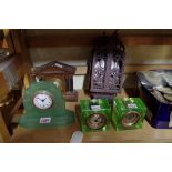 A German carved walnut cased wall clock; together with four other timepieces.