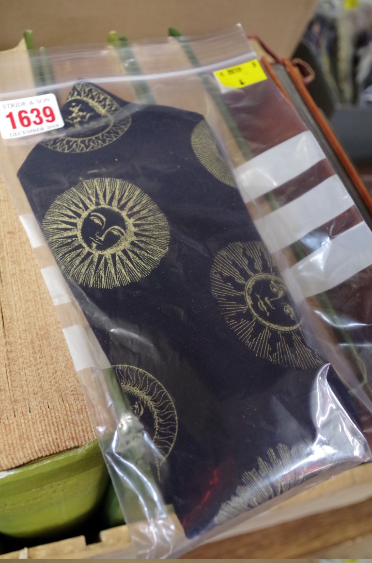 A gentleman's black and gold sun design tie by Fornasetti.