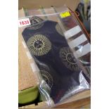 A gentleman's black and gold sun design tie by Fornasetti.