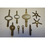 Five old watch keys and four old clock keys.