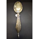 A Burmese white metal ladle, 32.5cm, 165g.