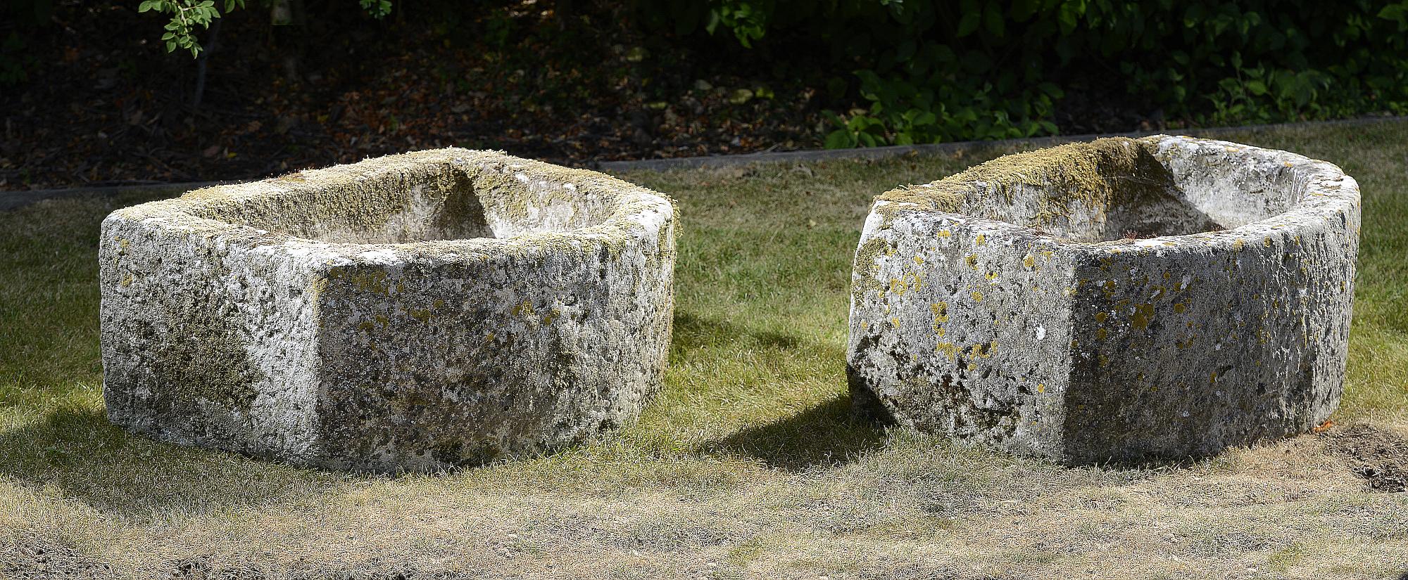 Planter/Water Feature: A pair of D-shaped carved limestone troughs34cm high by 83cm long by 61cm