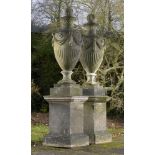 Planters: A pair of substantial composition stone urns on pedestals2nd half 20th century 282cm