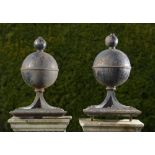 Architectural: A pair of unusual cast iron gate pier balls with pierced iron frameslate 19th