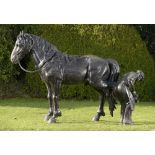 Equestrian/Garden Sculpture: A life size bronze group of a farrier shoeing a dray horse