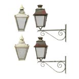 Lighting: A pair of sheet metal and wrought iron wall lanterns with bracketsearly 20th