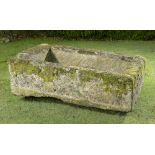 Planter/Water Feature: A carved limestone rectangular trough51cm high by 170cm long by 112cm deep