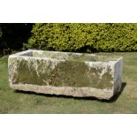 Planter/Water Feature: A carved limestone troughwith later composition stone divider60cm high by