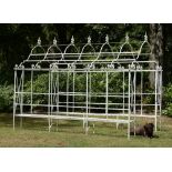 Garden Furniture: A wrought iron arbour enclosing seatsmid 20th century280cm high by 360cm long by