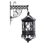 Lighting: A wrought and sheet iron lantern with bracket late 19th century 80cm high