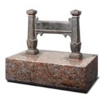 A Victorian cast iron boot scraper2nd half 19th century on granite base35cm long