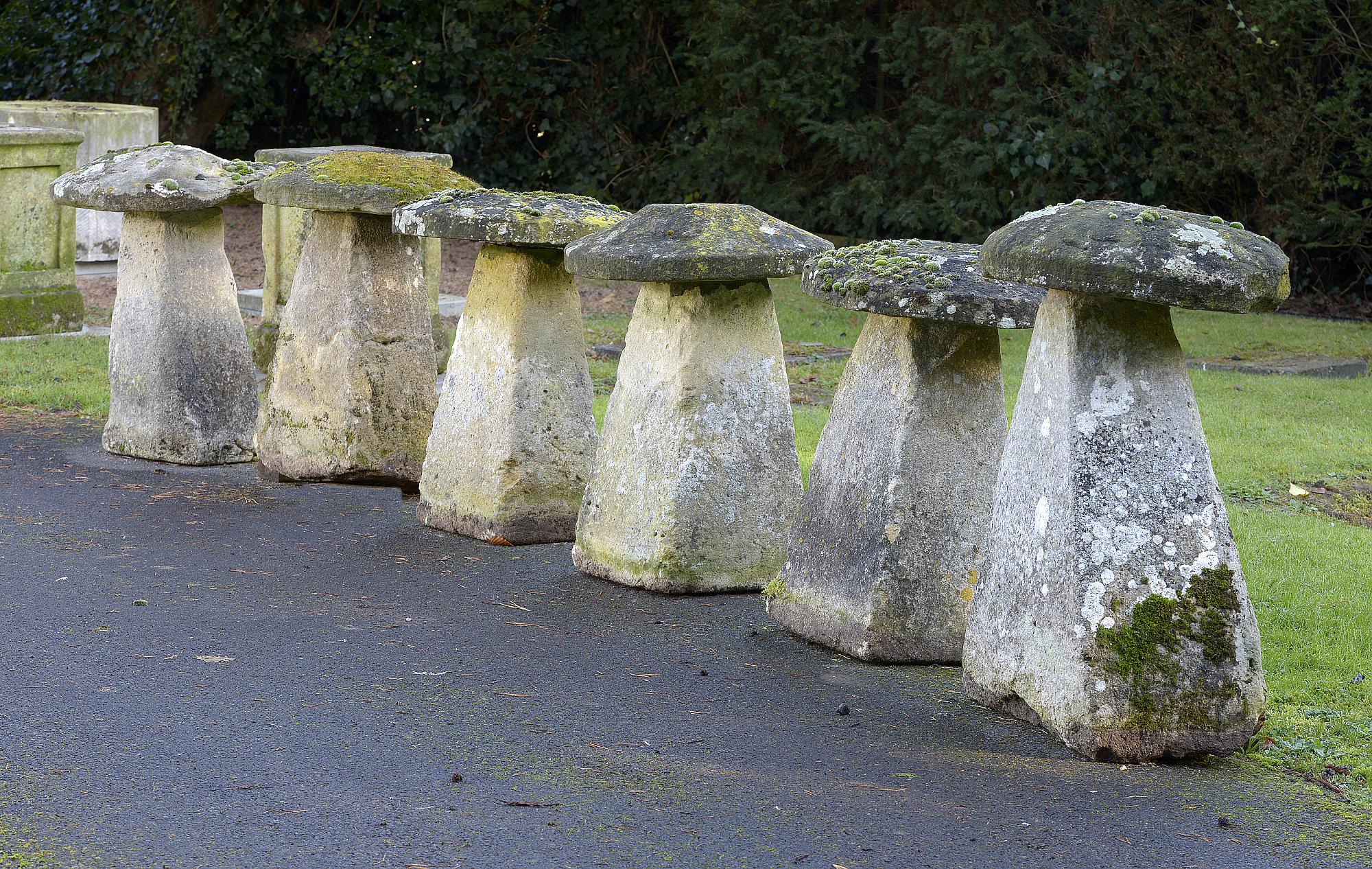 Garden Statuary: A harlequin set of six carved limestone staddlestonesthe tallest 87cm