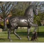 Equestrian/Garden Sculpture: A monumental over life size stallion, 304cm high by 340cm long