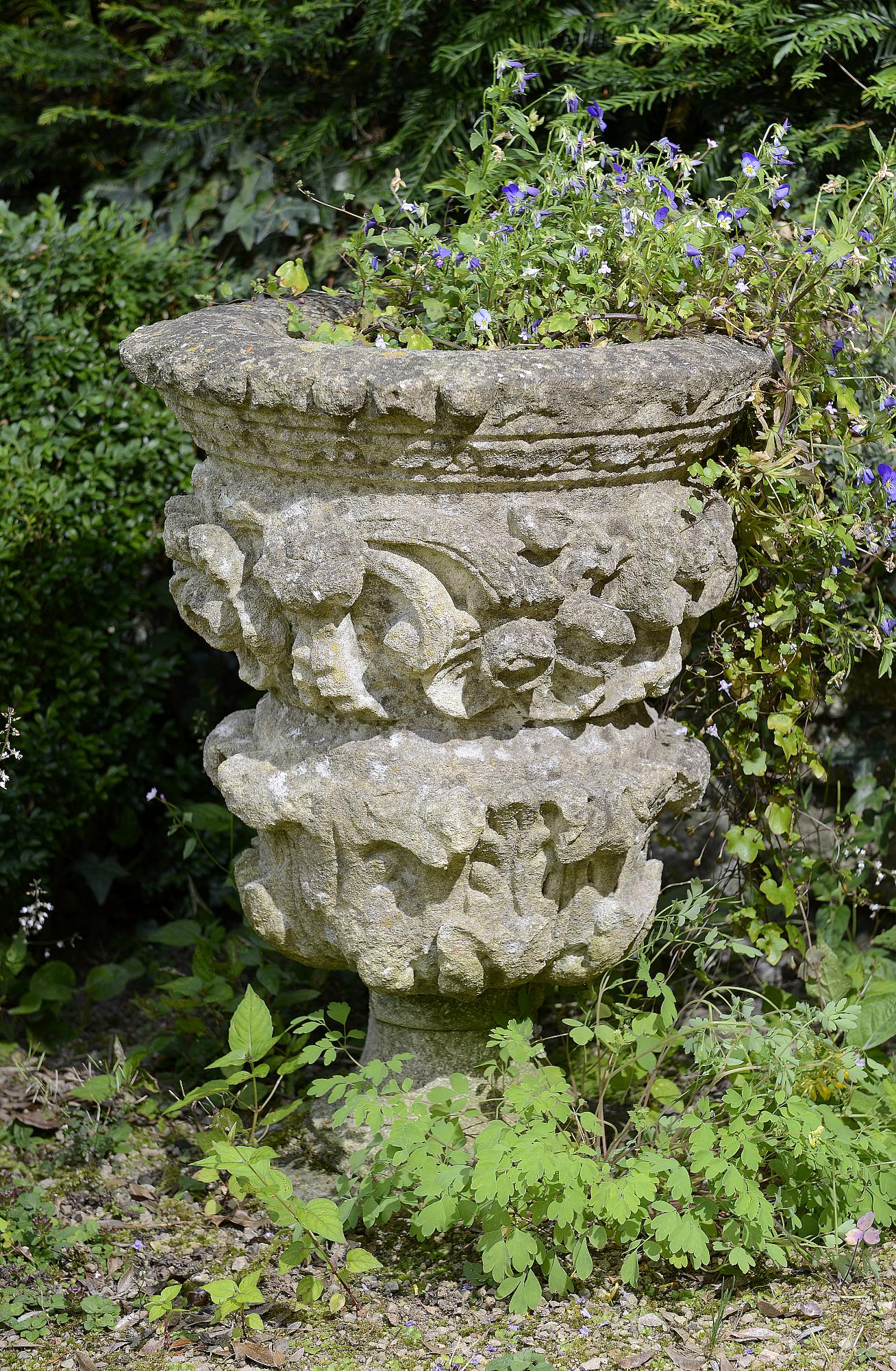 Planters: A near pair of Victorian carved stone urnscirca 186061cm high