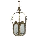 Lighting: An Edwardian brass lanternearly 20th centurywith cut glass panels131cm high by 35cm