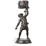 Sculpture: After the Antique: A bronze figure of Silenus holding aloft a planter bowlprobably