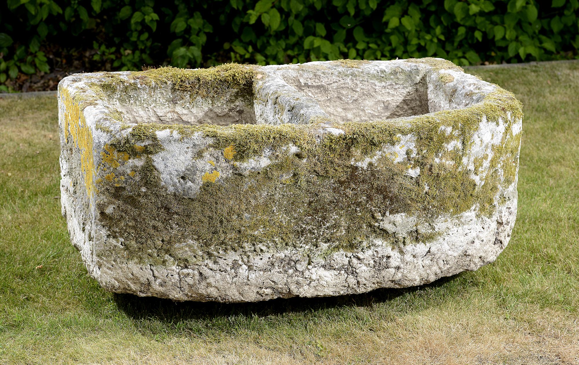 Planter/Water Feature: A carved D-shaped limestone trough with divider43cm high by 100cm long by