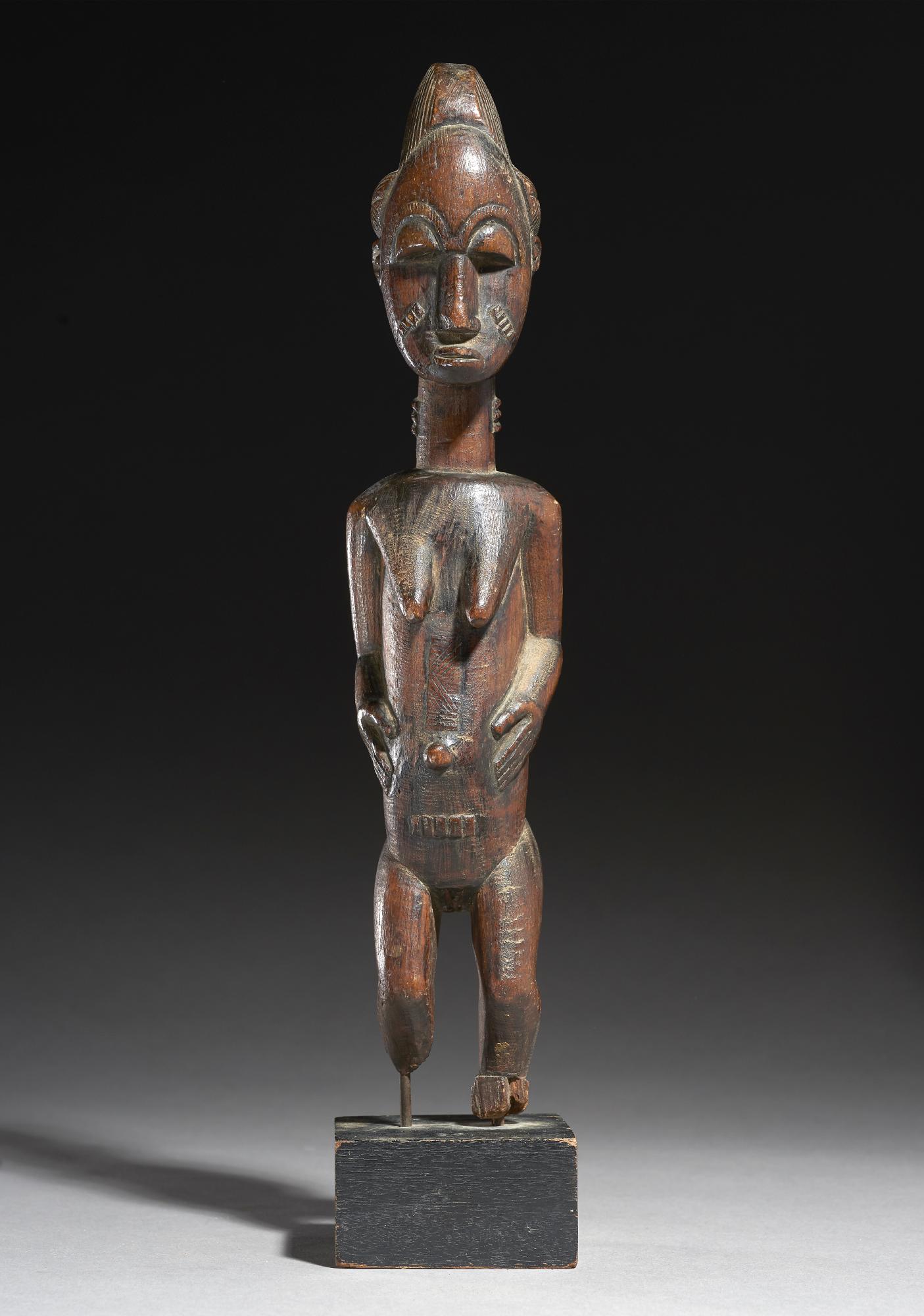 Tribal/Ethonographic: A standing female figure, Senufo, Ivory Coast, 1930’s 32cm, Delicate female