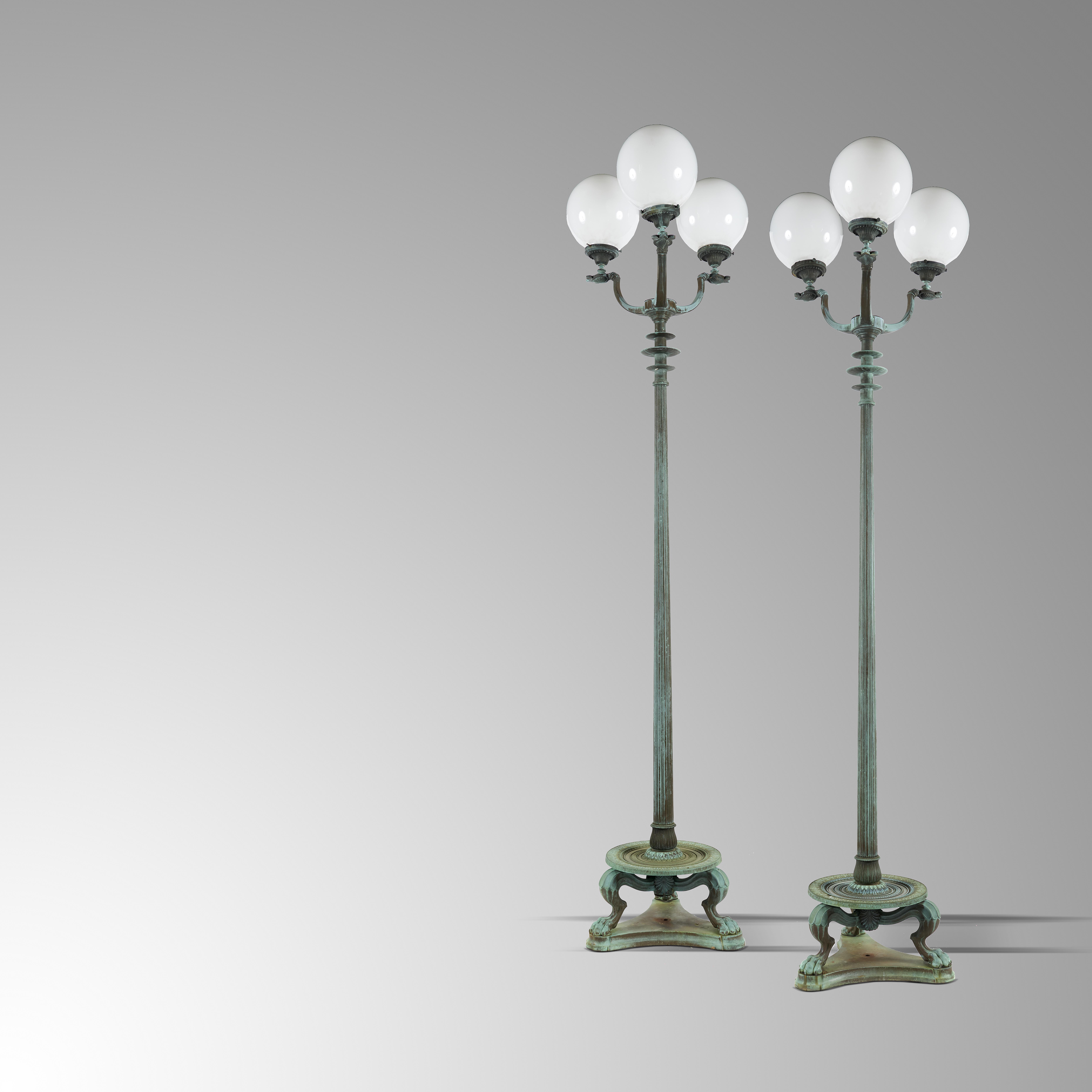 Light/Lantern: A pair of monumental bronze standing lights , early 20th century fitted with globes