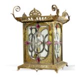 Lighting: An Edwardian brass lantern, early20th century with convex glazed oval panels 45cm high