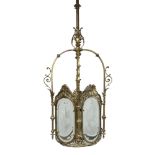 Lighting: An Edwardian brass lantern, early20th century with cut glass panels 131cm high by 35cm