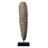 Fossils: A Neolithic pestle, Morocco, on bronze base, 40cm high