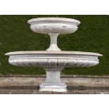 Water feature: A carved white marble two tier fountain, Italian, circa 1900, 140cm high by 180cm