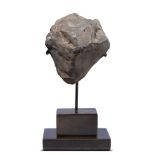 Fossils: A North West African 11141 impact Meteorite, Zuwairat, Mauritania, class H5 on bronze base,