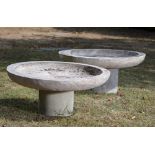 A pair of composition stone bird baths on stands, 2nd half 20th century, indistinctly signed, 85cm