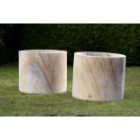 † A pair of substantial sandstone cylindrical wellhead/planters, modern, 75cm high by 90cm diameter