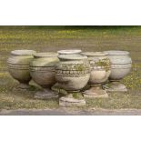 Plant pots/Planters: † A set of six carved sandstone urns, modern, 68cm high by 57cm diameter