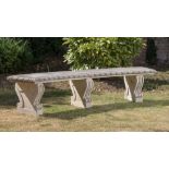 Garden Furniture: A carved limestone curved bench, modern, 240cm long