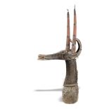 Tribal/Ethnographic:A wooden animal head,West African, mounted with embossed copper decoration and