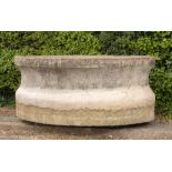 A monumental oval composition stone trough, French, mid 20th century, 101cm high by 240cm long by