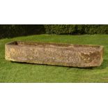 A rounded rectangular carved sandstone trough, 40cm high by 236cm long by 70cm deep