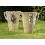 Plant pots/Urns: A pair of carved stone planters, mid 20th century with lug handles (two handles