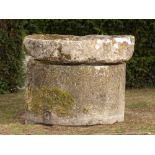 A carved stone wellhead with associated top, French 18th/19th century, 96cm high by 122cm diameter