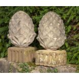 Finials: A pair of composition stone pineapples on associated bases2nd half 20th century55cm high