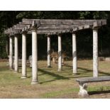 † A carved limestone and oak pergola, modern, 250cm high by 350cm wide by 800cm long