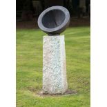 A bronze and roughly hewn stone semi hemispherical sundial by David Harber 140cm high