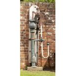 An unusual Victorian copper and wrought iron pump,1st half 19th centuryon wooden back plate 183cm