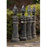 A set of four cast iron bollards, 2nd half 19th century, 70cm high, together with a set of four cast