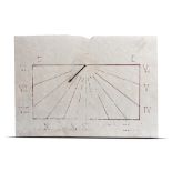 A carved white marble wall sundial, early 20th century with replaced brass gnomen, 49cm high by 69cm