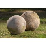 Finials: † Two carved sandstone gate pier balls modernthe largest 46cm diameter