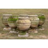 Plant pots/Planters: † A similar set of sandstone urns, modern, 68cm high by 57cm diameter
