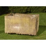 † A carved stone trough, 90cm high by 155cm long by 88cm deep