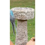 A carved granite bird bath, early 20th century, 75cm high