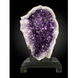 Minerals: An impressive amethyst geode Brazil 122cm.; 48ins high on wooden stand