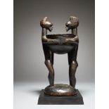 Tribal: Rare and elegant Songye bowl carried by two standing figures Songye people, DRC 38cm