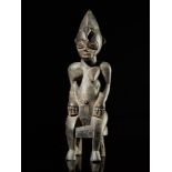 Tribal: Senufo blackened statue with crescent coiffure on stool Senufo people, Ivory Coast 34cm